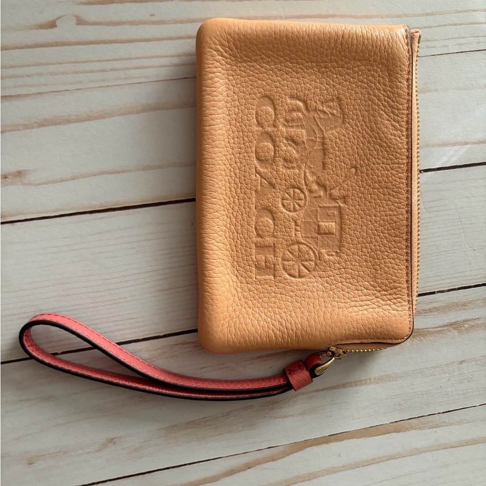 Coach blush and taffy wristlet